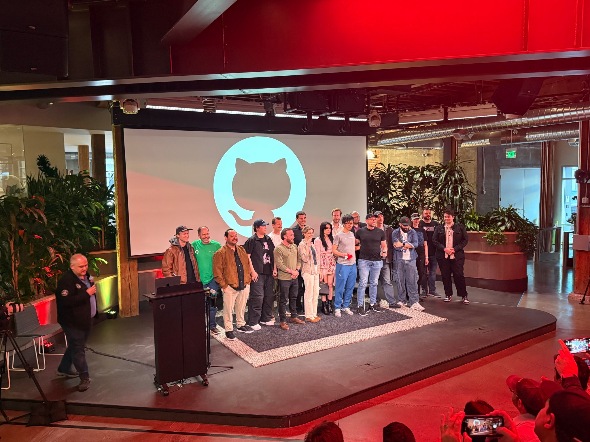 OpenClaw maintainers gathered on stage at GitHub after the OpenClaw after-hours event.